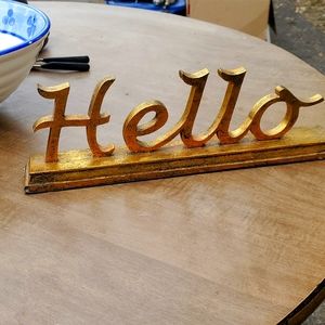 Guilded Hello sign.